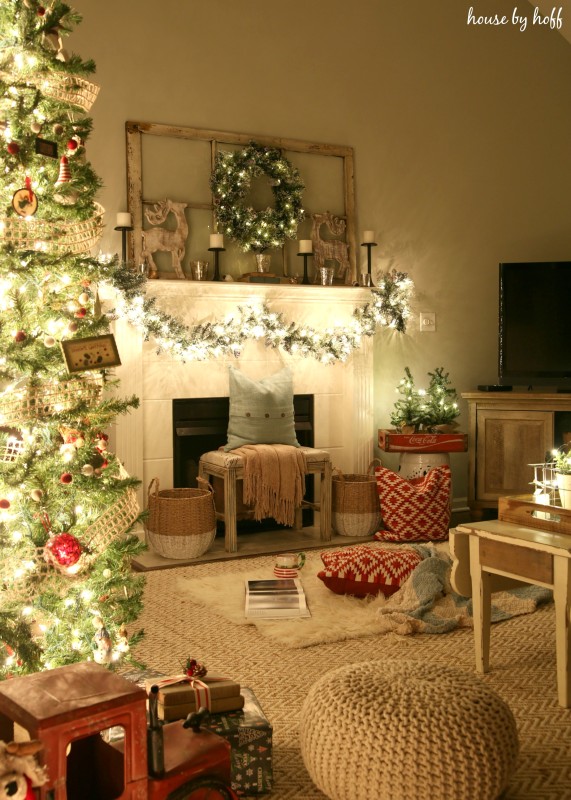 The fireplace mantel with Christmas decorations on it.