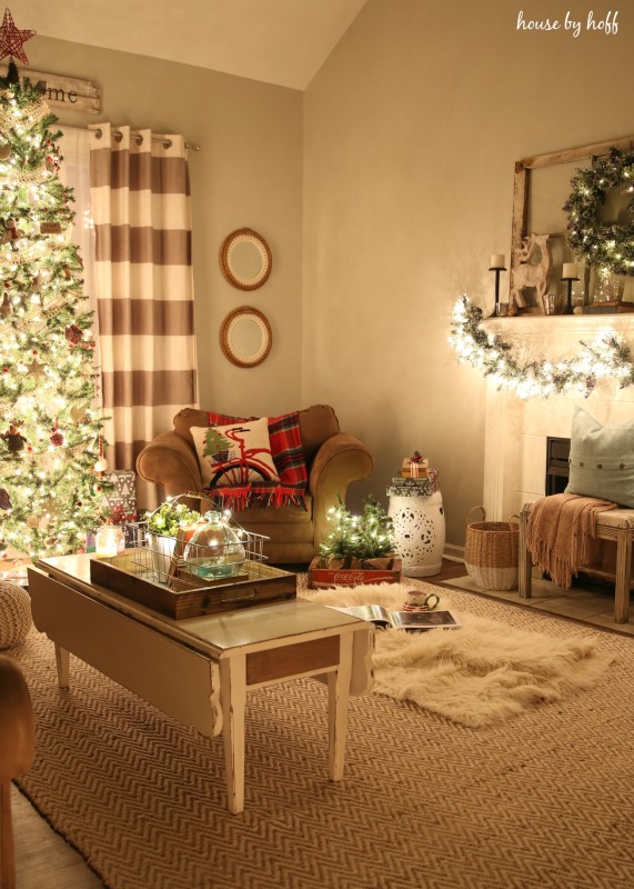 A faux fur rug by the fireplace in the living room.