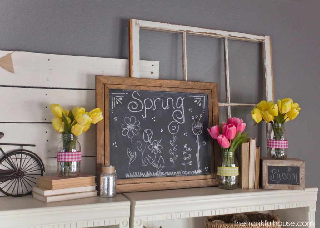 Mantel vignette with yellow and pink tulips.