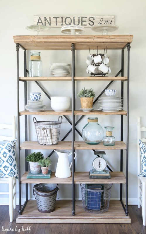 Shelf with sign saying antiques above it.