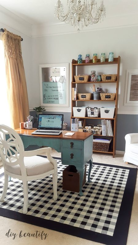 A teal blue desk with a wooden top