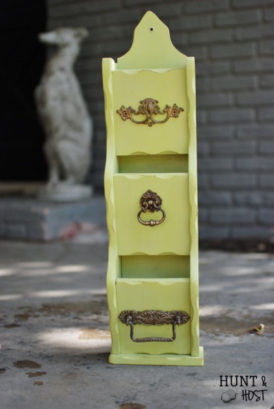 Green painted letter box with antique findings.