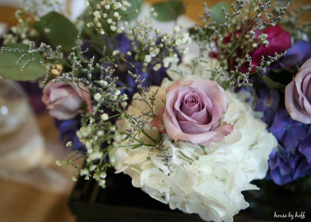 Floral arrangements on table.