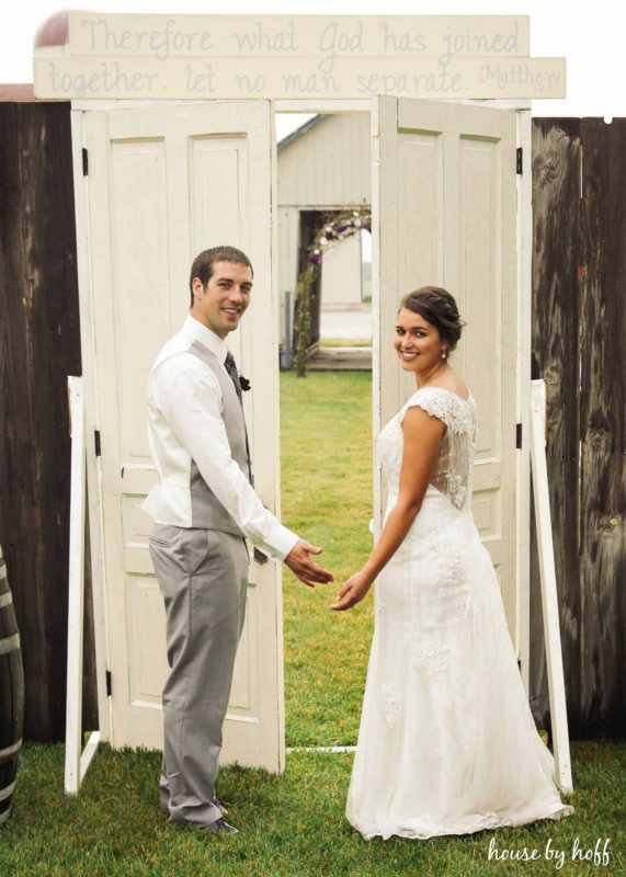 Vintage doors with sign above it.