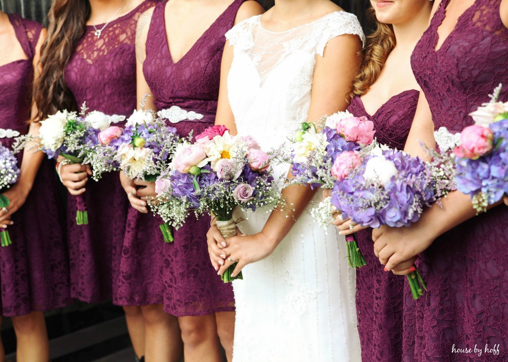 The bouquets with purple, white, and pink flowers.