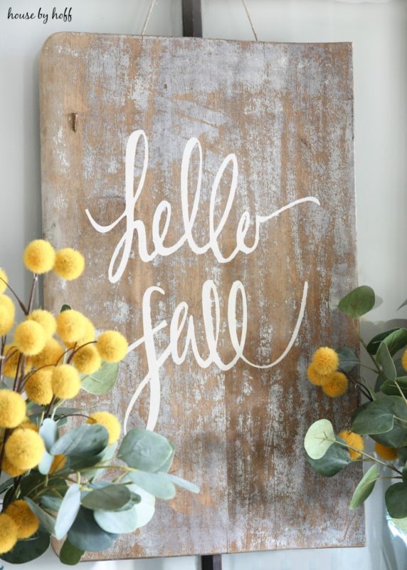 Hello Fall wooden sign on pewter side table.