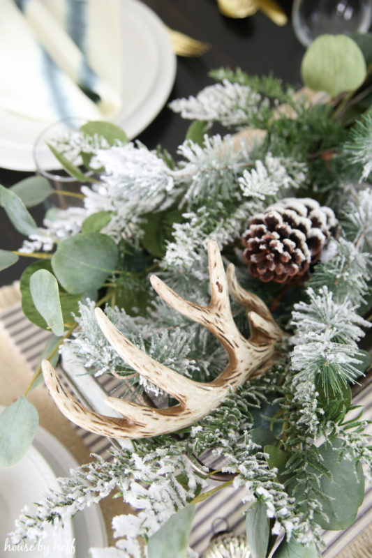 Flocked pine cones in the centerpiece.