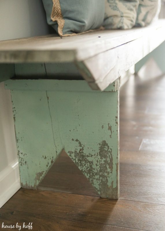 Rustic old bench on wooden floor.