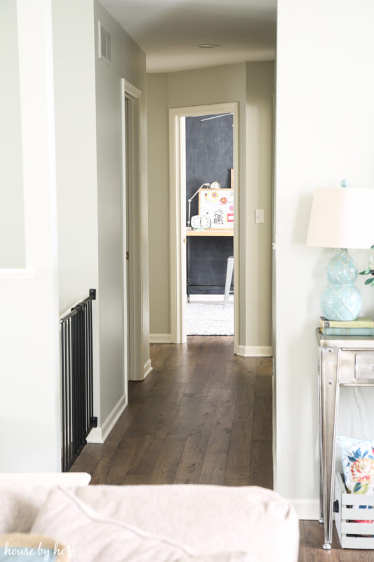 Laminate flooring in the hallway leading to the bedroom.