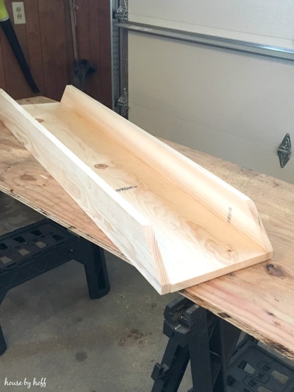 A wooden board on a cutting table.