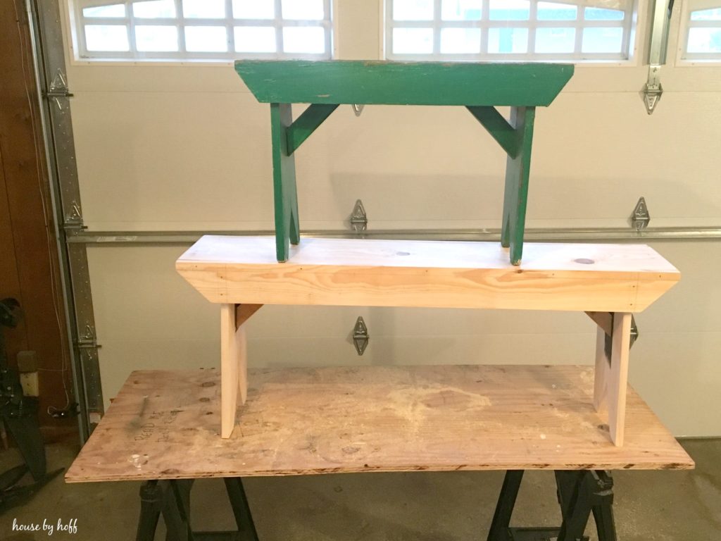 A small bench on top of a larger bench.