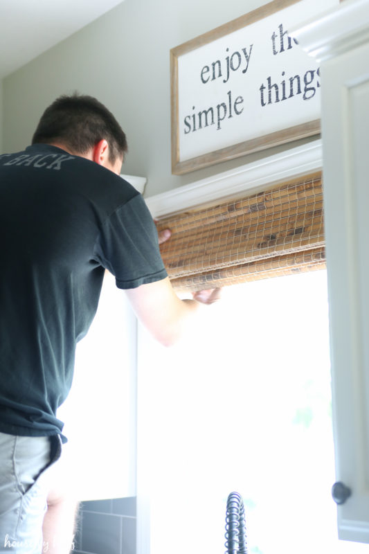 Snapping the blinds into place.