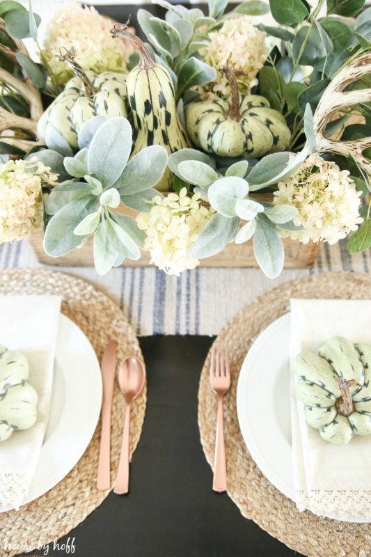 Close up of the centerpiece and the copper forks and knives.