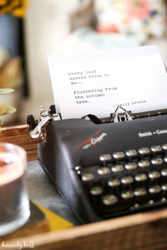 Typewriter with poem typed out on white paper.