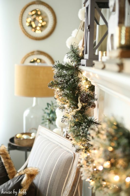 Up close of the green garland on the mantel.
