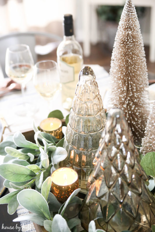 Up close picture of the bottle brush trees and clear glass Christmas trees.