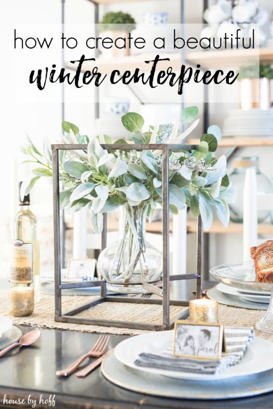 How to create a winter centerpiece poster with the table set with white plates, and large green centerpiece.