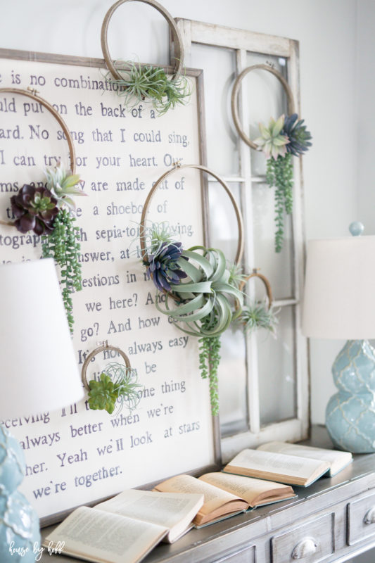 The succulent wreaths on the wall in the hallway.