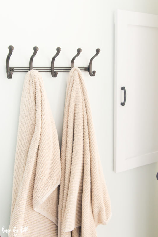 Light pink towels on a towel rack.