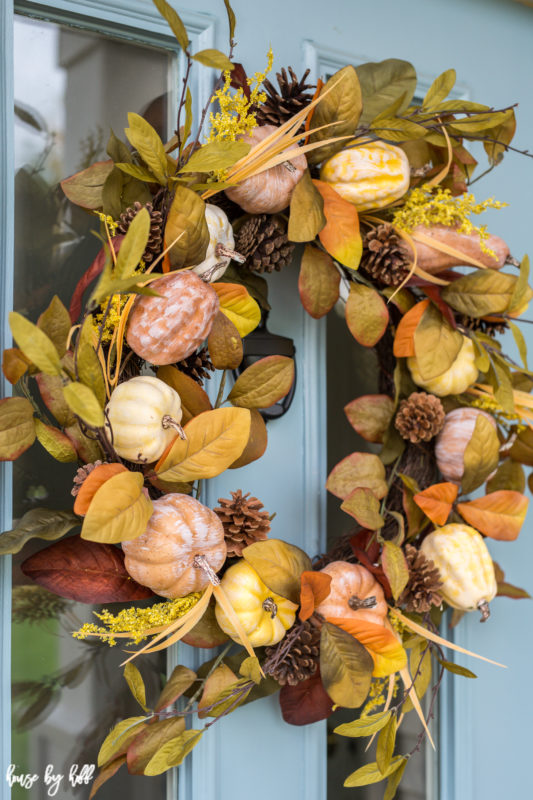 Yellow, orange, green and brown wreath on door.