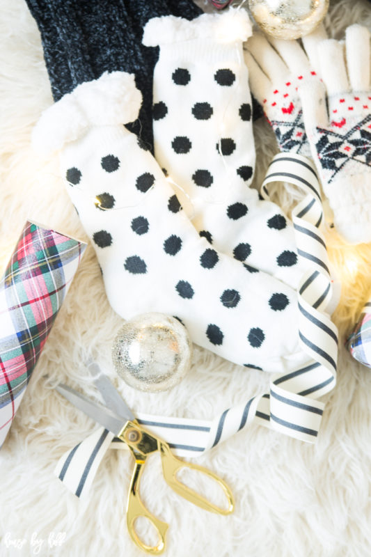 Scissors, black and white striped ribbon and polka dot reading socks.