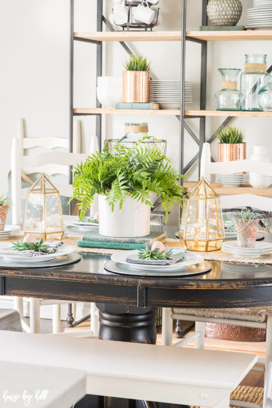 The table is set for guests in the dining room.