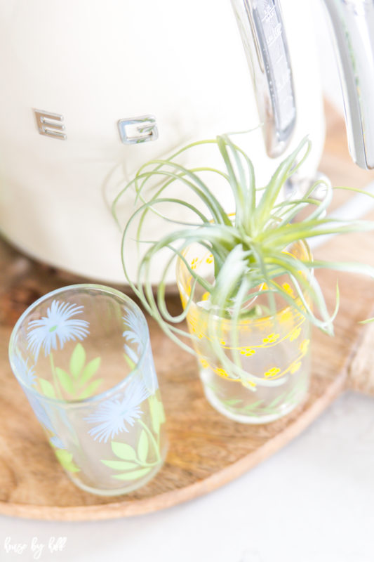 Clear vintage glasses with a floral pattern.