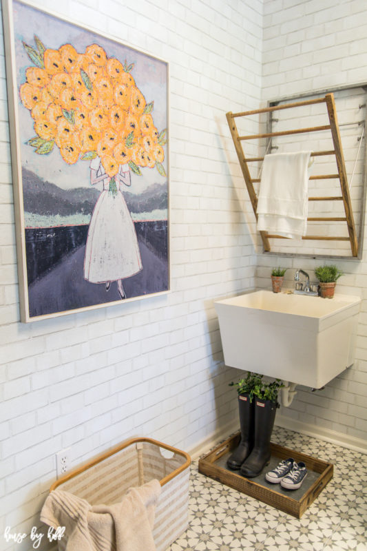 Mudroom with wood framed floral art