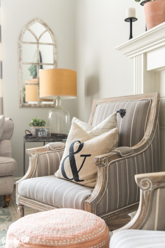 French Armchair with Neutral Throw Pillows