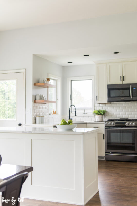 Renovated Kitchen with White Subway Tile and Open Shelving.