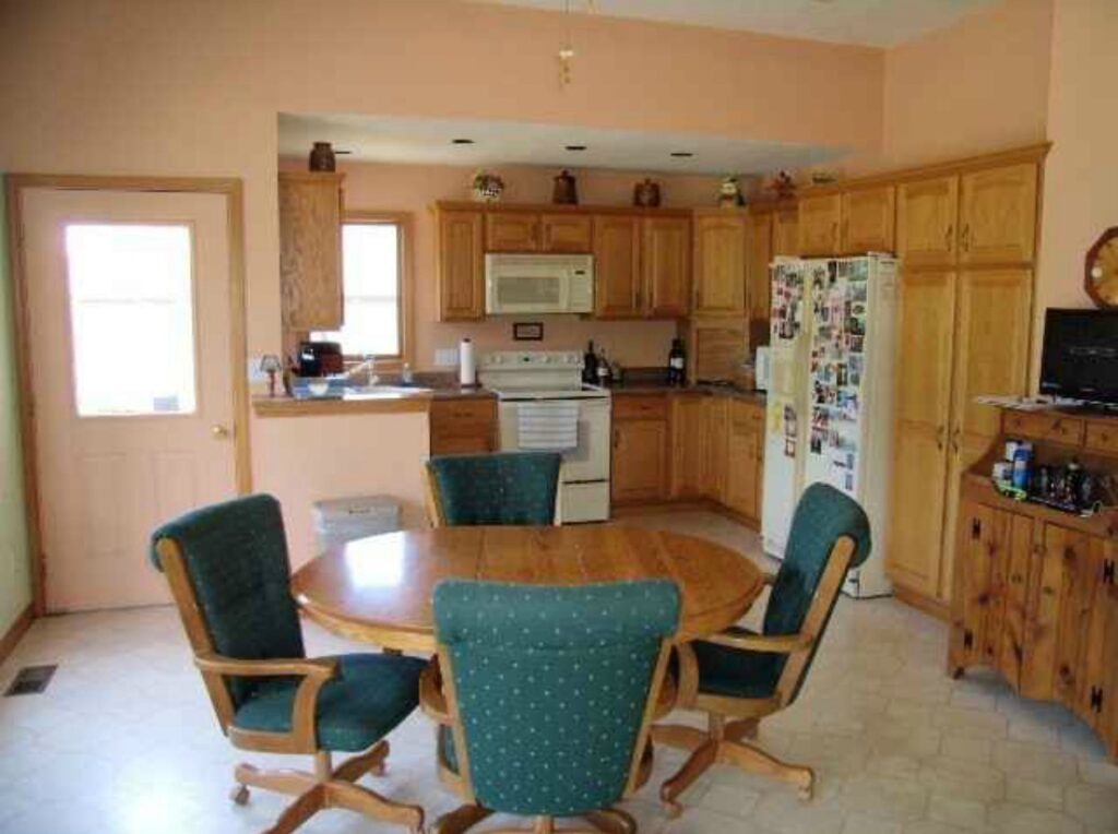 Wooden cabinet and linoleum flooring.