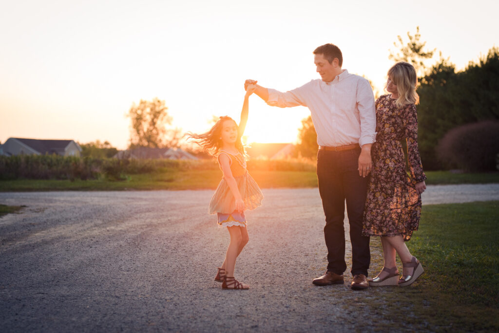 Twirling the little girl.