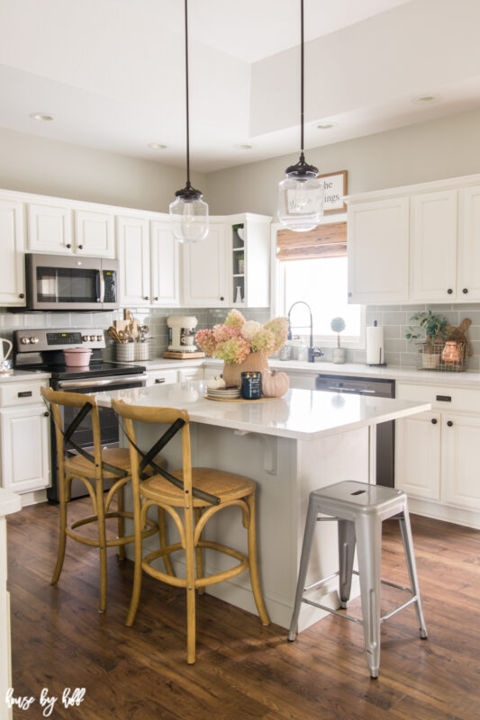 A Gray and White Kitchen Decorated for Fall with Hydrangea Centerpiece.