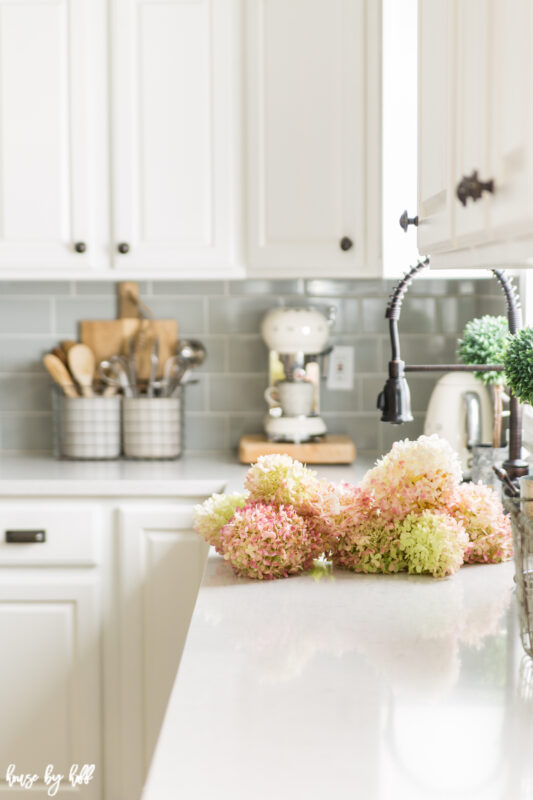 The Pink Hydrangeas lying on the white counter.