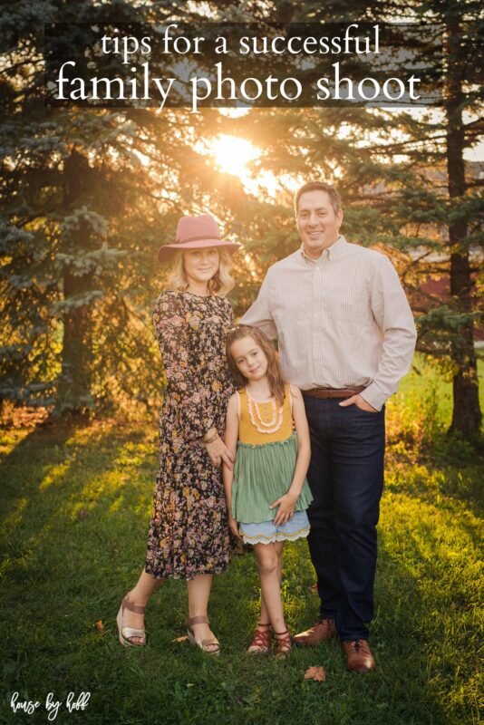 April, husband and daughter posing for the camera.