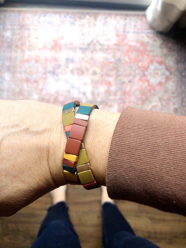 Multi coloured wooded bracelets.