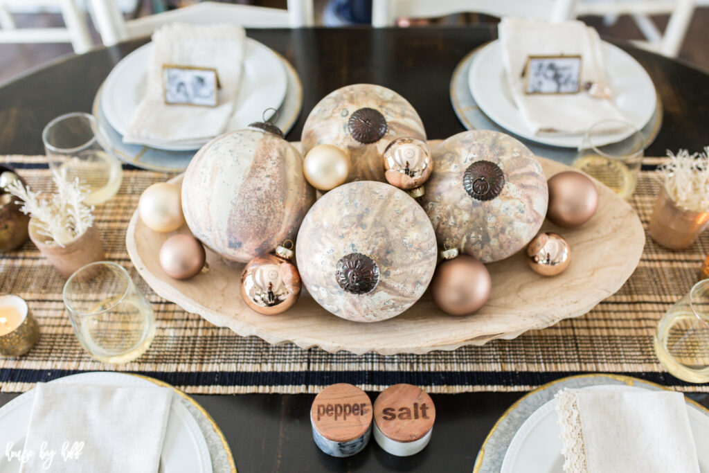 Large Copper and Cream Marbled Ornaments in Wood Bowl with Striped Table Runner