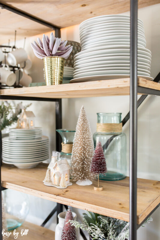 Open Shelving Decorated with Bottle Brush Trees in pink and white.