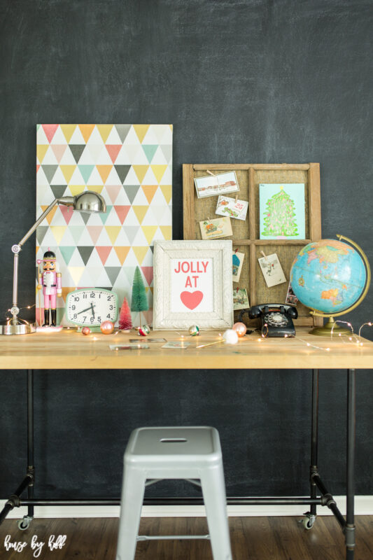 Chalkboard Wall with Triangle Art and Piping Table.