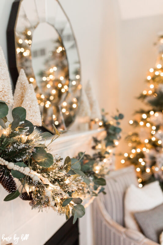 A large mirror is on the fireplace mantel.