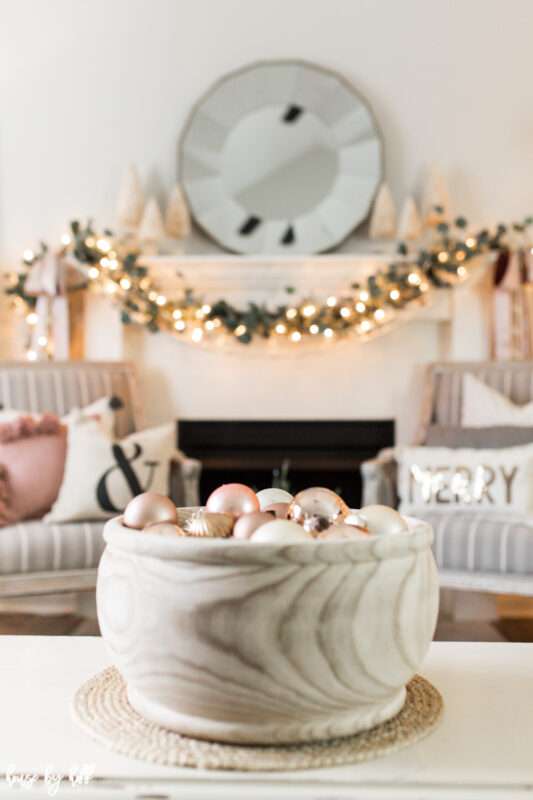 Big Wooden Bowl on Coffee Table with Rose Gold and Cream Ornaments