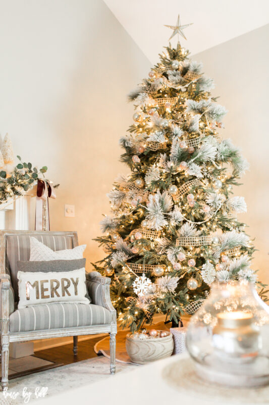 Large Christmas Tree decorated in neutral and pink ornaments.