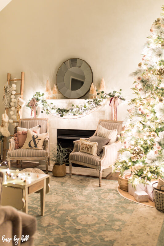 A neutral living room decorated in soft tones for Christmas.