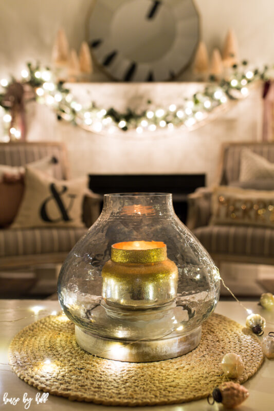 A gold candle is on the coffee table.