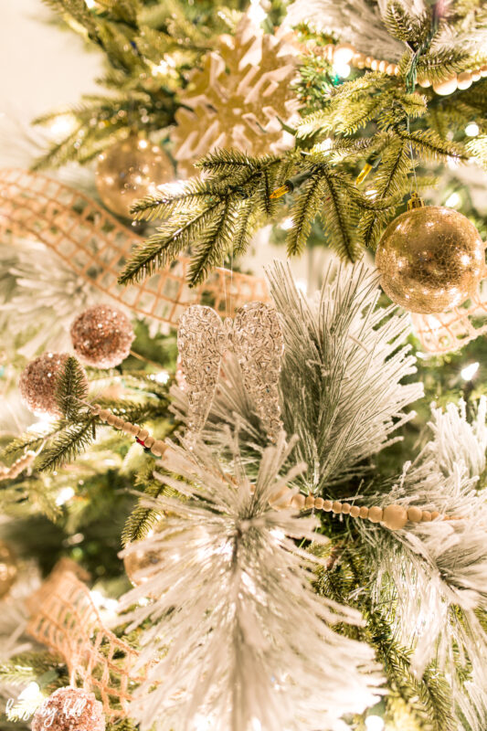 Up close picture of the angle wings hanging on the Christmas tree.