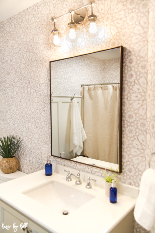 Bathroom Wallpaper with Bronze Rectangular Mirror and Chrome Light Fixture