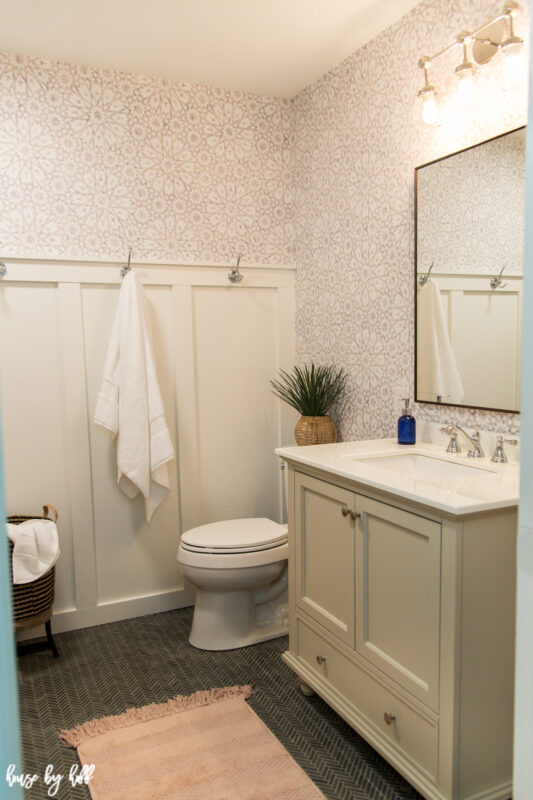 DIY Guest Bathroom Remodel with Wallpaper, Herringbone Floor, Board and Batten Wall, and Greige Vanity