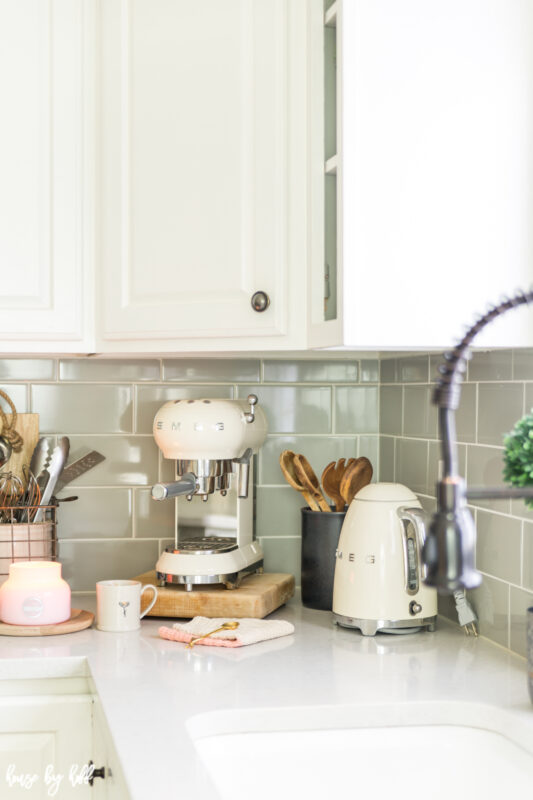 White Smeg Appliances in Gray and White Kitchen