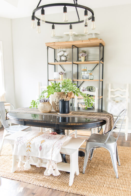 Gray Dining Room with Open Shelves and Black Chandelier