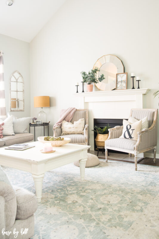 Bright Gray Living Room with Antique Blue Rug and White Furniture